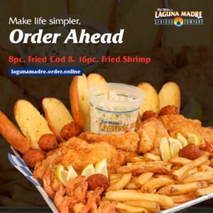 Make life simpler, Order Ahead. Laguna Madre Logo. 8pc. Fried Cod & 16pc. Fried Shrimp. Lagunamadre.order.online. The image features our 8pc Fried Cod & 16pc. Fried Shrimp family meal served with French fries, coleslaw, slices of garlic bread, hush puppies, and lemon wedges served on a blue and white checked paper on a silver tray. The background features the family meal in the background with a black overlay.